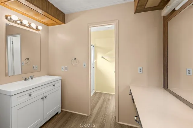 a bathroom with a glass shower door