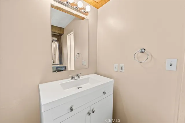 a view of backyard with deck and outdoor seating