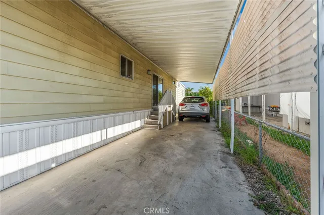 a view of backyard with deck and outdoor seating