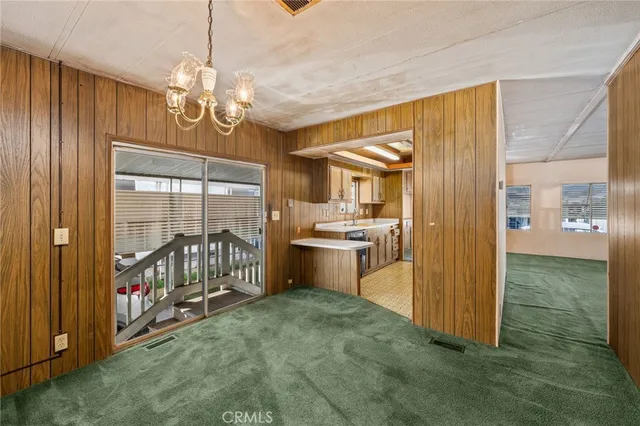 a open kitchen with a sink and stainless steel appliances