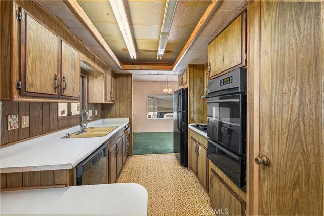 a kitchen with stainless steel appliances granite countertop a sink and stove