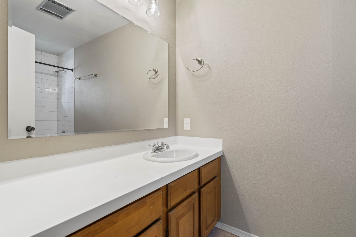8005 Hood Circle, Unit B Austin, TX 78745 - Photo 13 of 18 a bathroom with a sink and a mirror