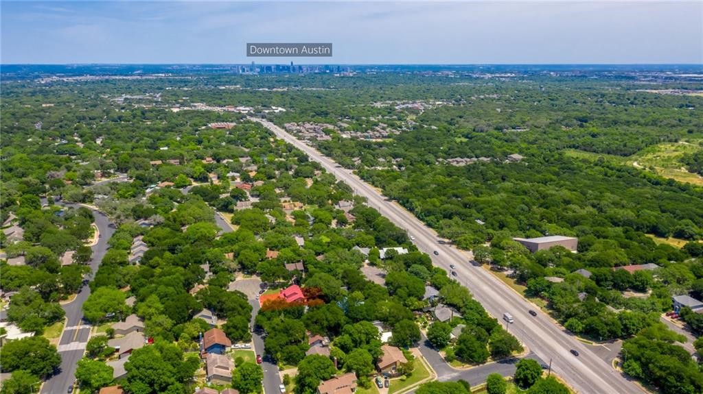 8005 Hood Circle, Unit B Austin, TX 78745 - Photo 4 of 18 a view of a city with lush green forest
