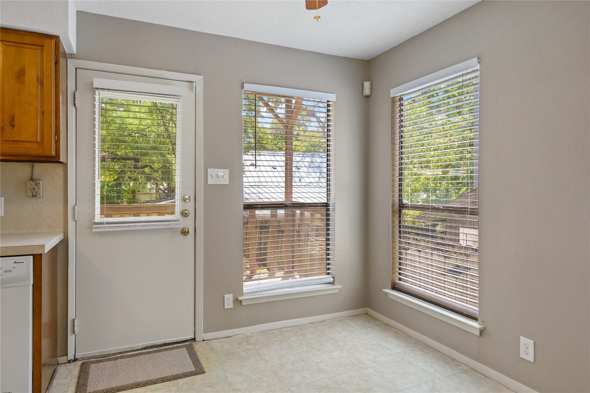 8005 Hood Circle, Unit B Austin, TX 78745 - Photo 8 of 18 a view of an empty room with a window
