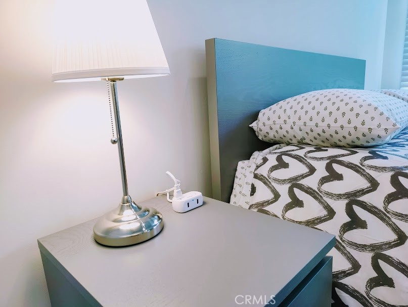 748 1/2 South Ridgeley Drive Los Angeles, CA 90036 - Photo 4 of 5 a bedroom with a bed and a table