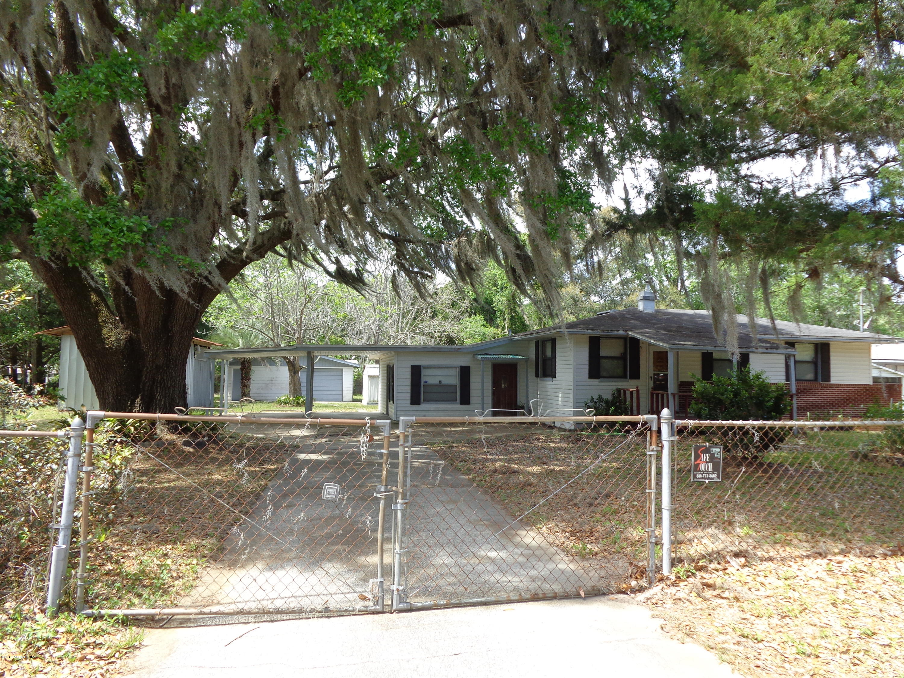 13294 Yellow Bluff Road Jacksonville, FL 32226 - Photo 1 of 21 front view of a house with a yard
