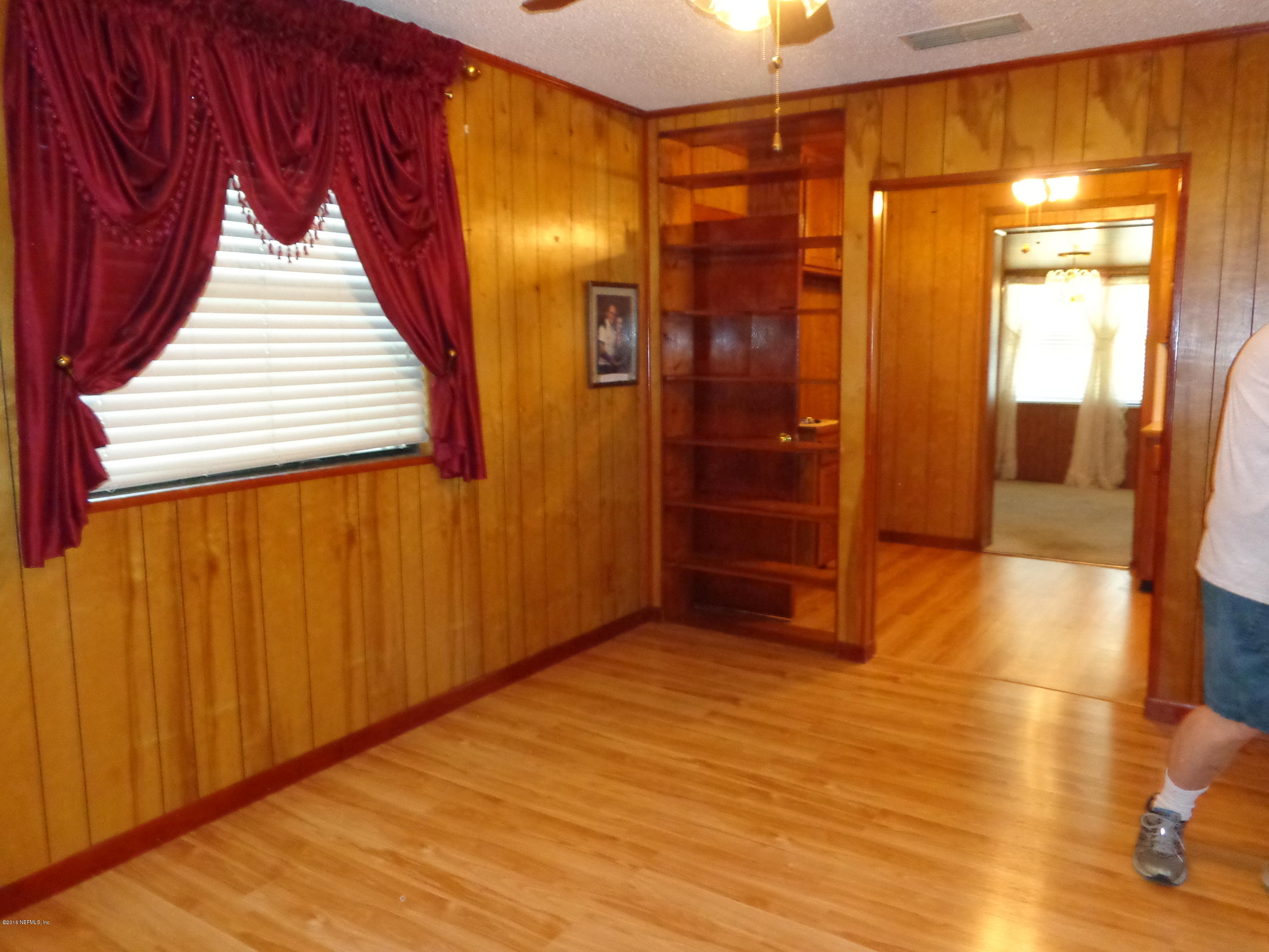 13294 Yellow Bluff Road Jacksonville, FL 32226 - Photo 4 of 21 a view of hallway with a large window and wooden floor