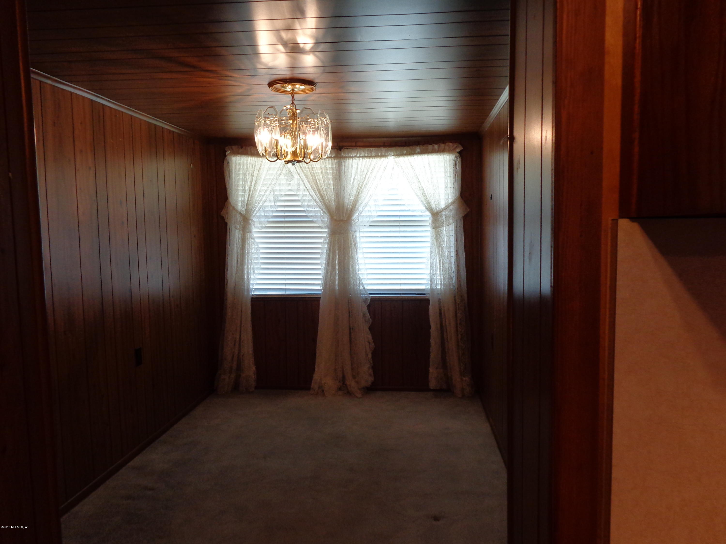 13294 Yellow Bluff Road Jacksonville, FL 32226 - Photo 6 of 21 a view of a livingroom with an empty space and a window