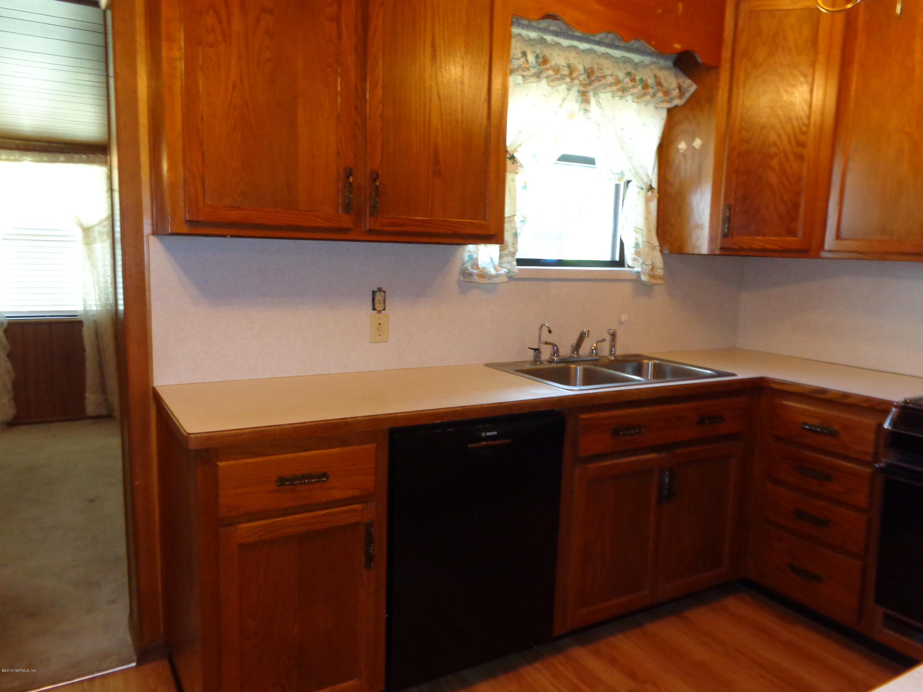 13294 Yellow Bluff Road Jacksonville, FL 32226 - Photo 8 of 21 a kitchen with a sink and cabinets