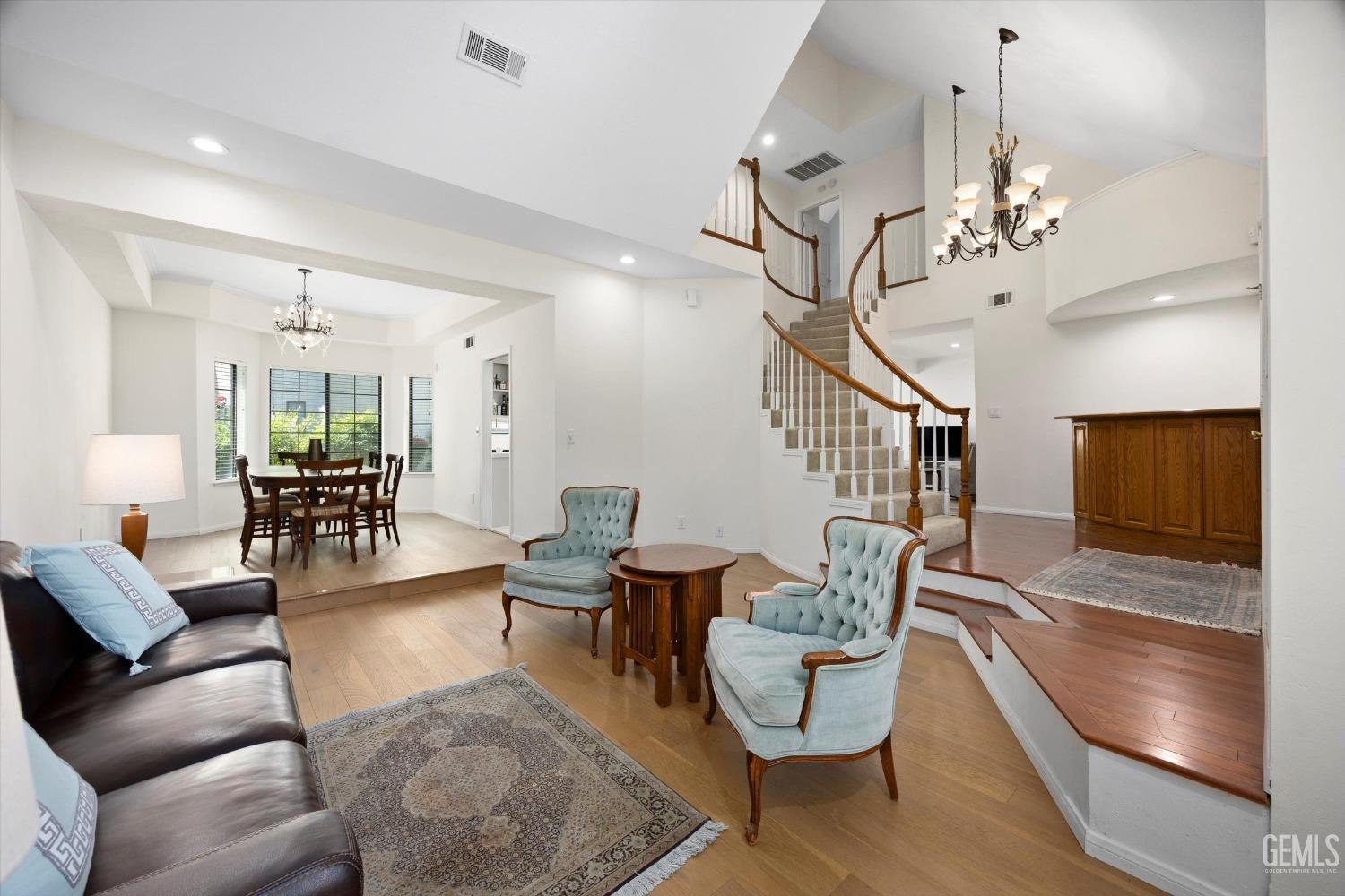 Undisclosed Address Bakersfield, CA 93309 - Photo 12 of 48 a living room with furniture and wooden floor