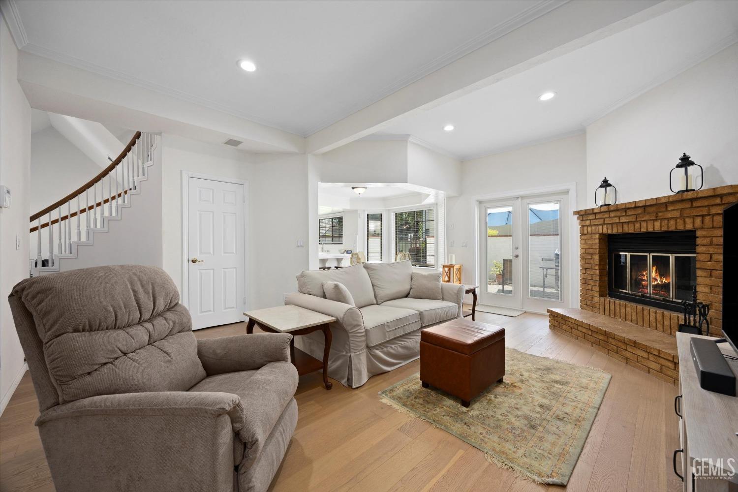 Undisclosed Address Bakersfield, CA 93309 - Photo 15 of 48 a living room with furniture and a fireplace