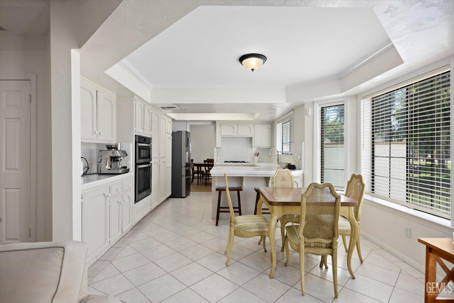 Undisclosed Address Bakersfield, CA 93309 - Photo 17 of 48 a view of a dining room with furniture and window