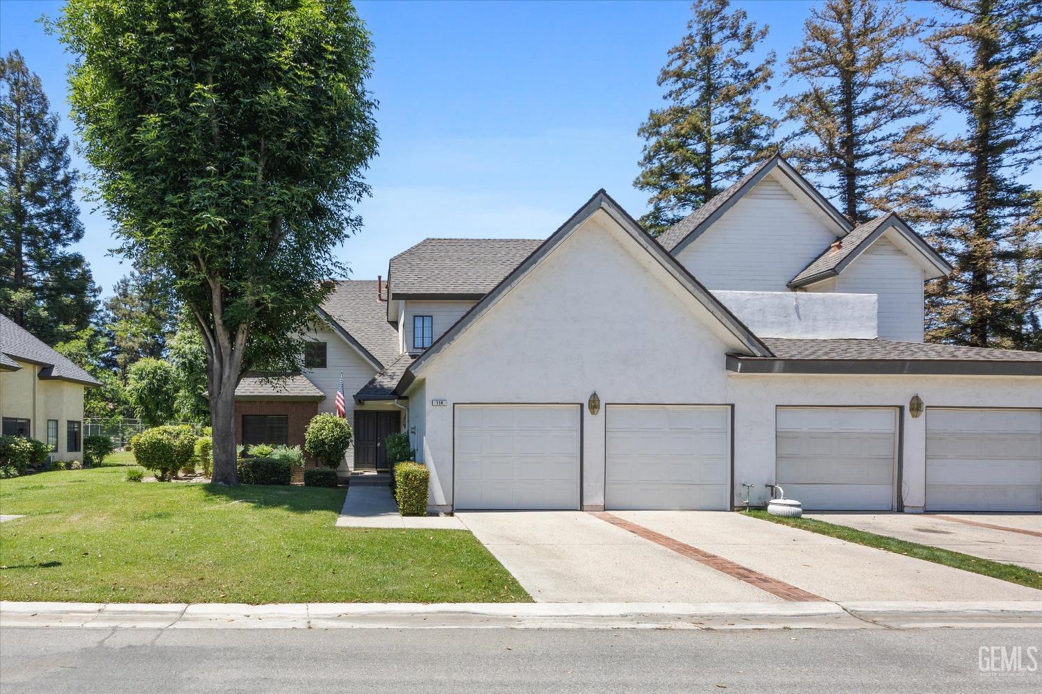 Undisclosed Address Bakersfield, CA 93309 - Photo 2 of 48 a view of a house with a yard and large tree