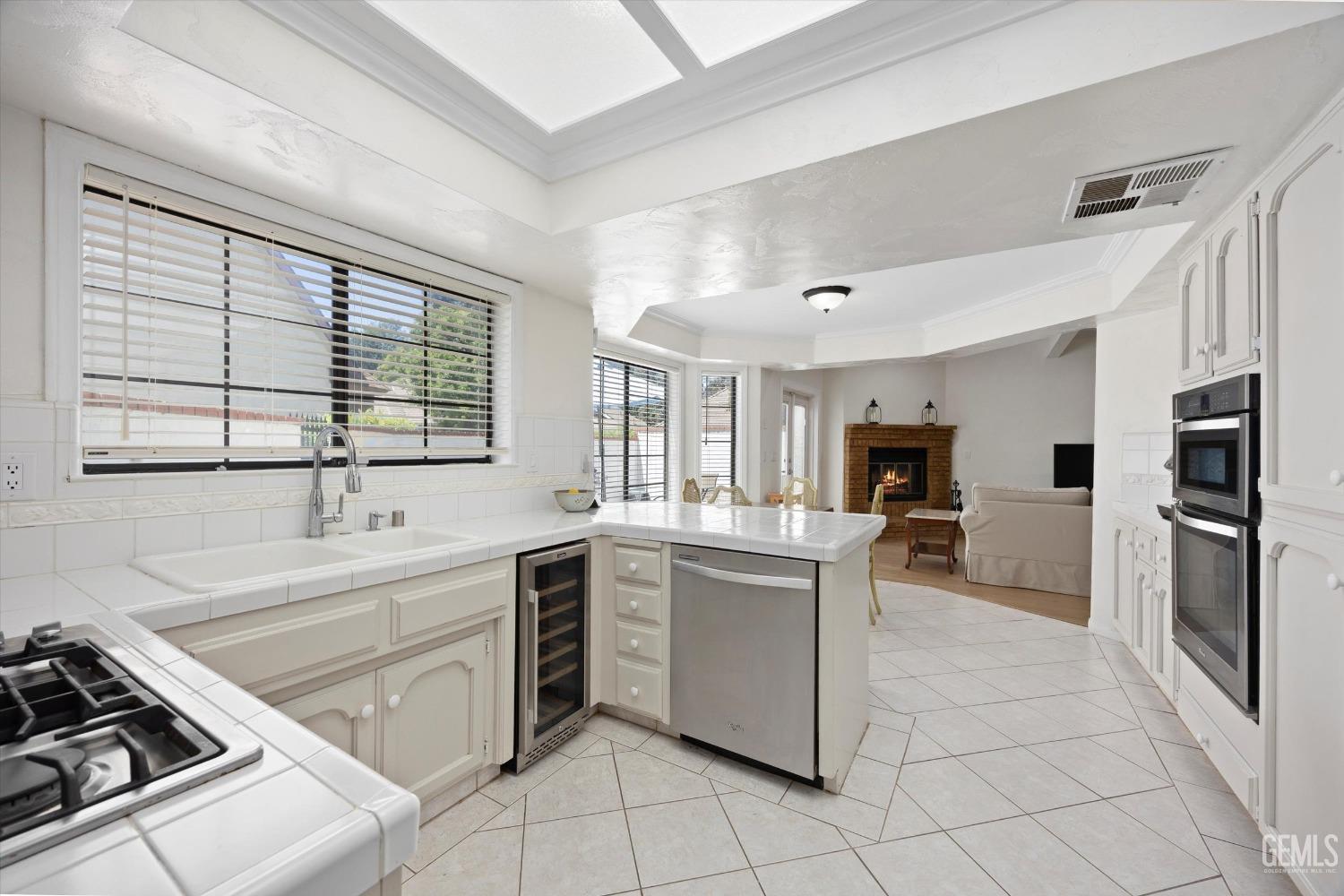 Undisclosed Address Bakersfield, CA 93309 - Photo 21 of 48 a kitchen with a sink cabinets and stainless steel appliances