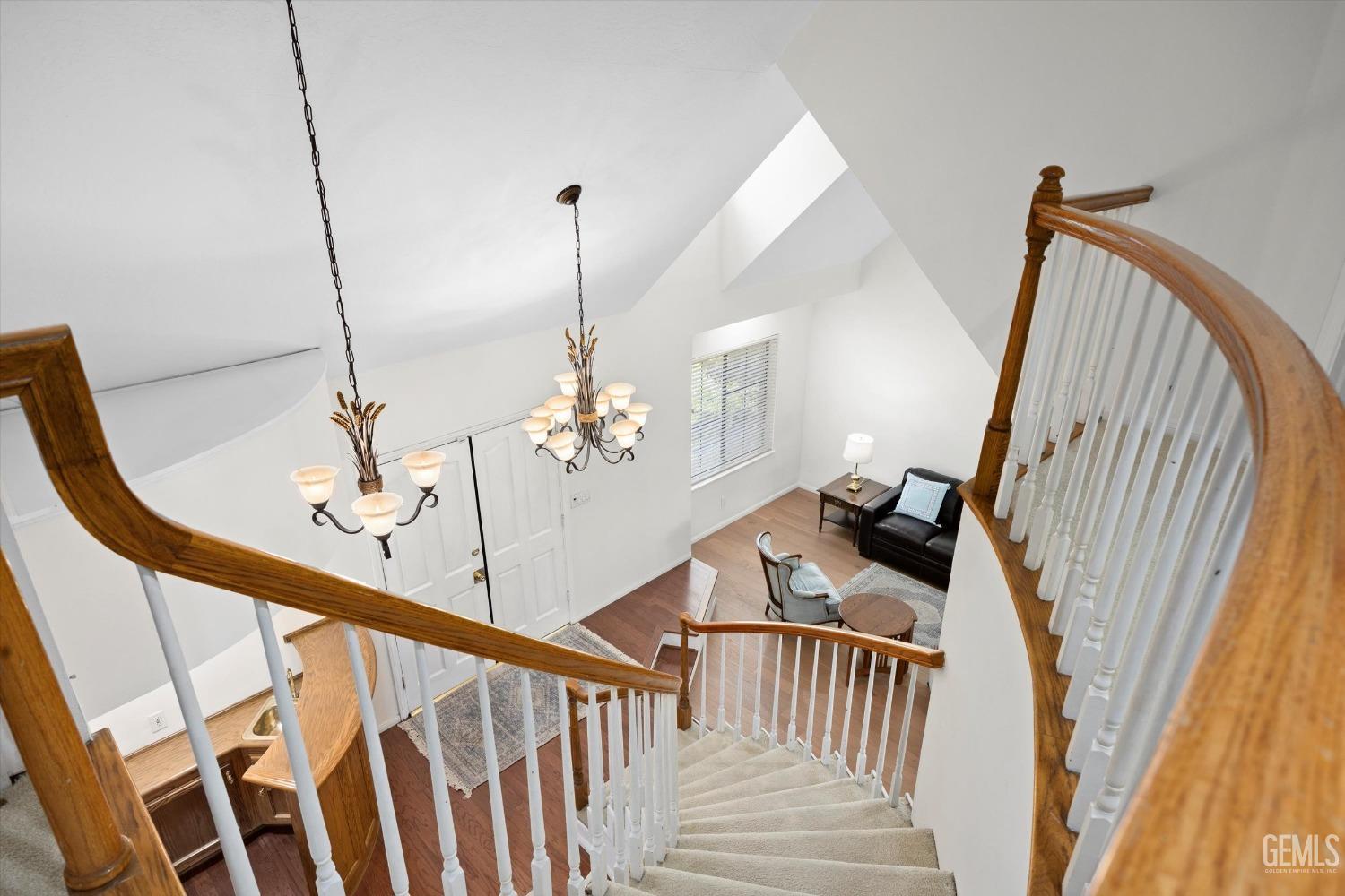 Undisclosed Address Bakersfield, CA 93309 - Photo 22 of 48 a view of an entryway wooden floor and staircase