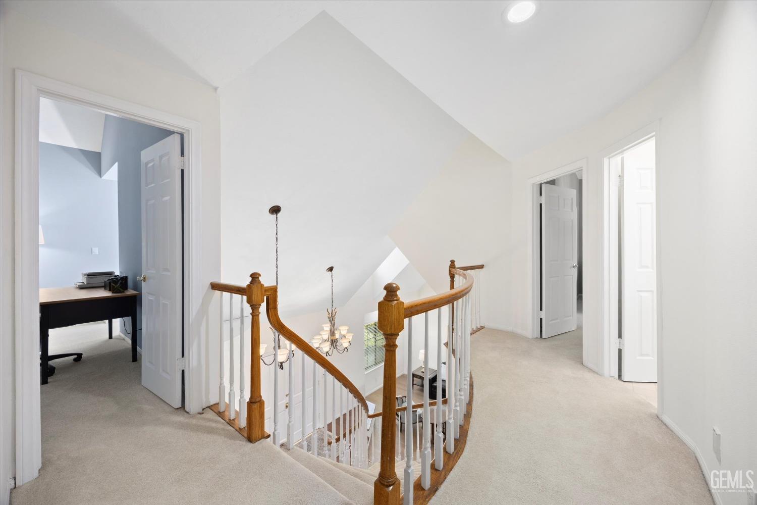 Undisclosed Address Bakersfield, CA 93309 - Photo 23 of 48 a view of a hallway with windows and stairs
