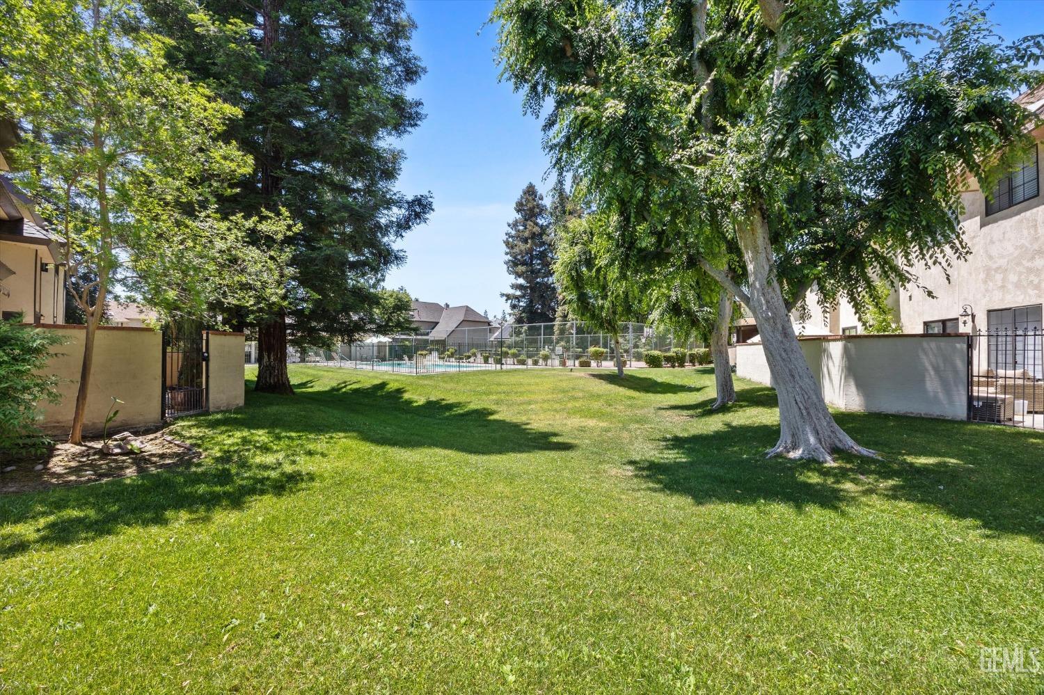 Undisclosed Address Bakersfield, CA 93309 - Photo 38 of 48 a view of a tree in a yard with a house