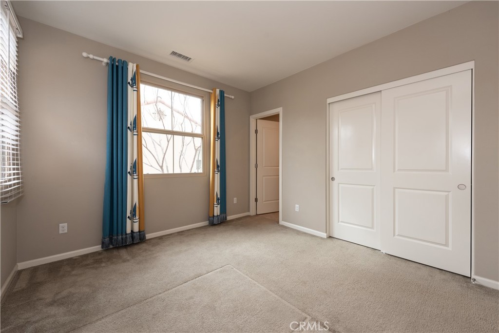 107 Desert Lotus Irvine, CA 92618 - Photo 15 of 21 an empty room with windows