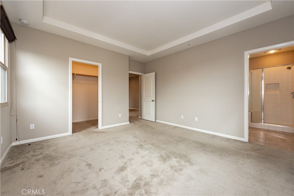 107 Desert Lotus Irvine, CA 92618 - Photo 18 of 21 an empty room with closet and a bathroom
