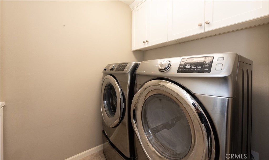 107 Desert Lotus Irvine, CA 92618 - Photo 19 of 21 a utility room with dryer and washer