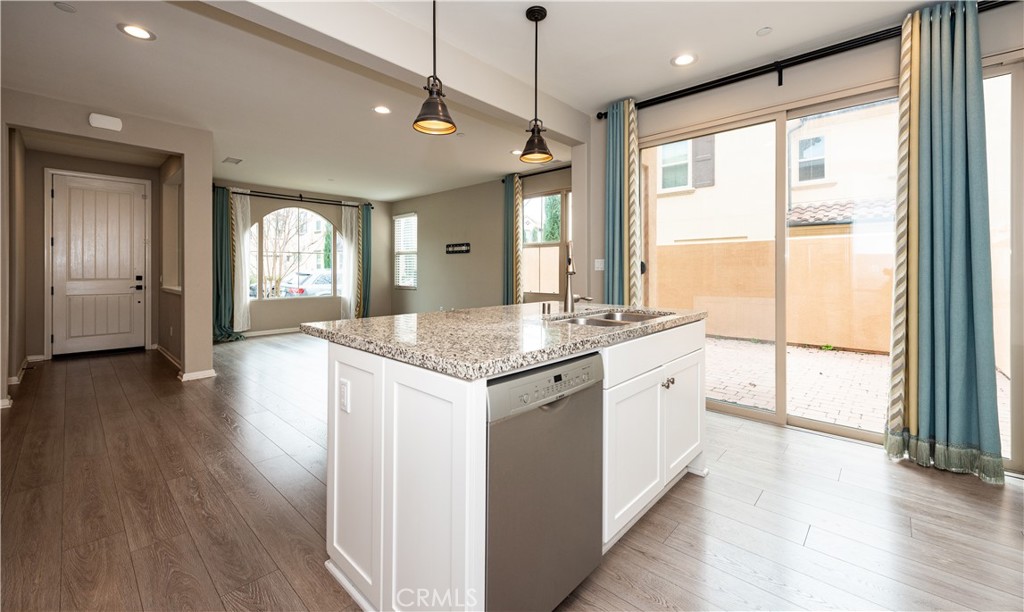 107 Desert Lotus Irvine, CA 92618 - Photo 5 of 21 a bathroom with a granite countertop sink and a large window
