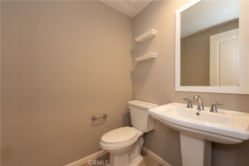 107 Desert Lotus Irvine, CA 92618 - Photo 7 of 21 a bathroom with a sink and a toilet