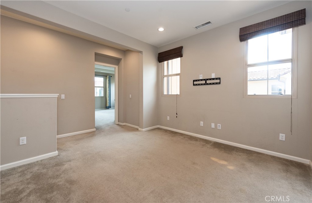 107 Desert Lotus Irvine, CA 92618 - Photo 8 of 21 an empty room with windows and closet