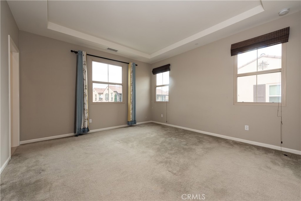 107 Desert Lotus Irvine, CA 92618 - Photo 9 of 21 an empty room with windows
