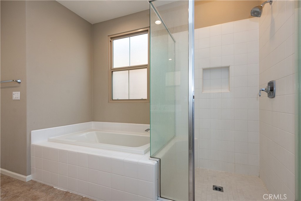 107 Desert Lotus Irvine, CA 92618 - Photo 10 of 21 a white bath tub sitting next to a window