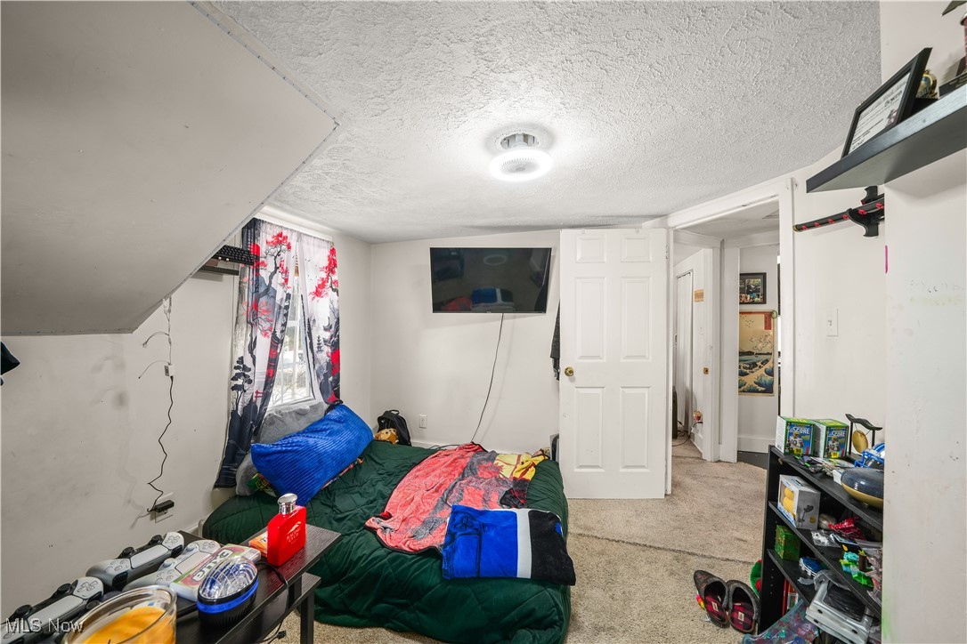 1951 Walton Road Kent, OH 44240 - Photo 15 of 19 Bedroom with a textured ceiling and light colored carpet