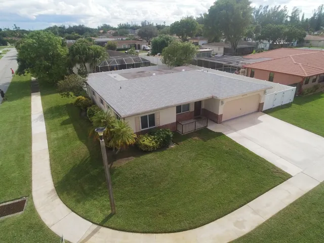 an aerial view of a house having yard