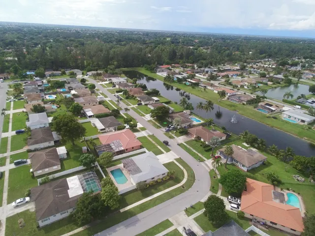 an aerial view of residential houses with outdoor space