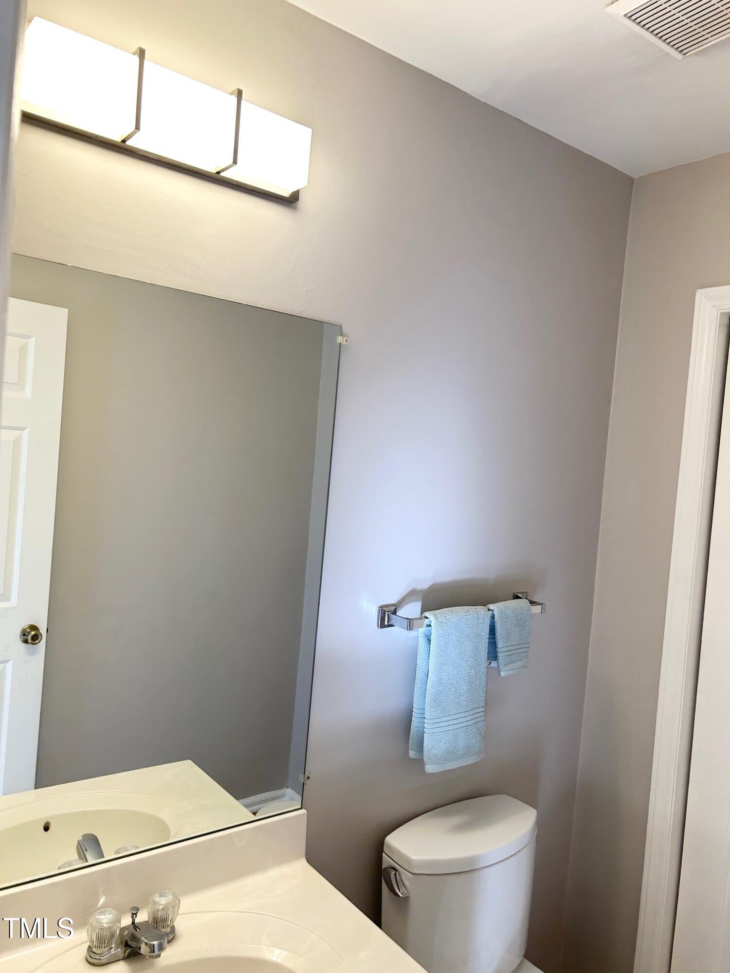 7341 Sweet Bay Lane Raleigh, NC 27615 - Photo 17 of 28 Downstairs half bath, new paint , new light fixture