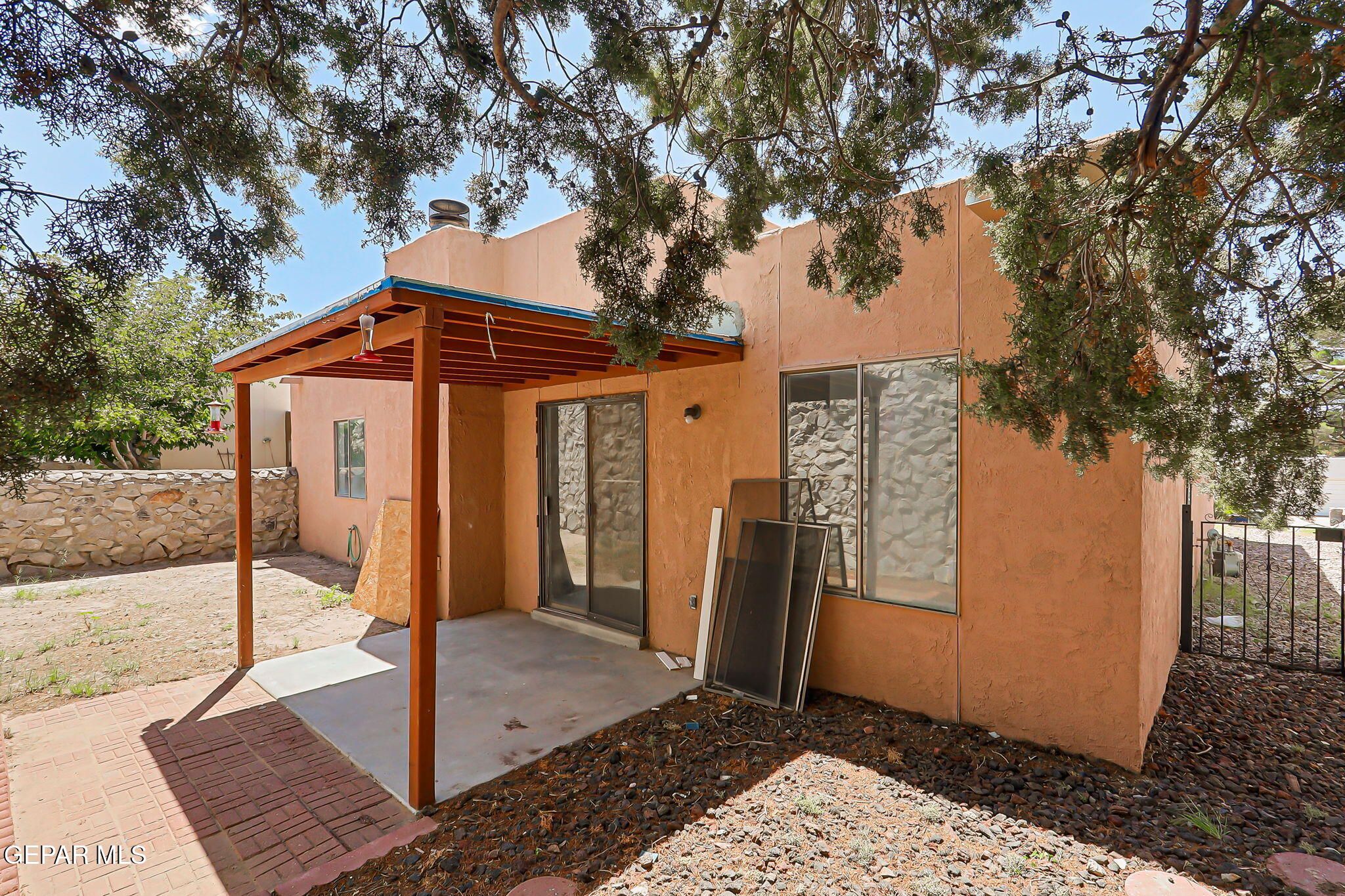 1053 Hillrise Court Las Cruces, NM 88011 - Photo 13 of 53 a front view of a house with a tree