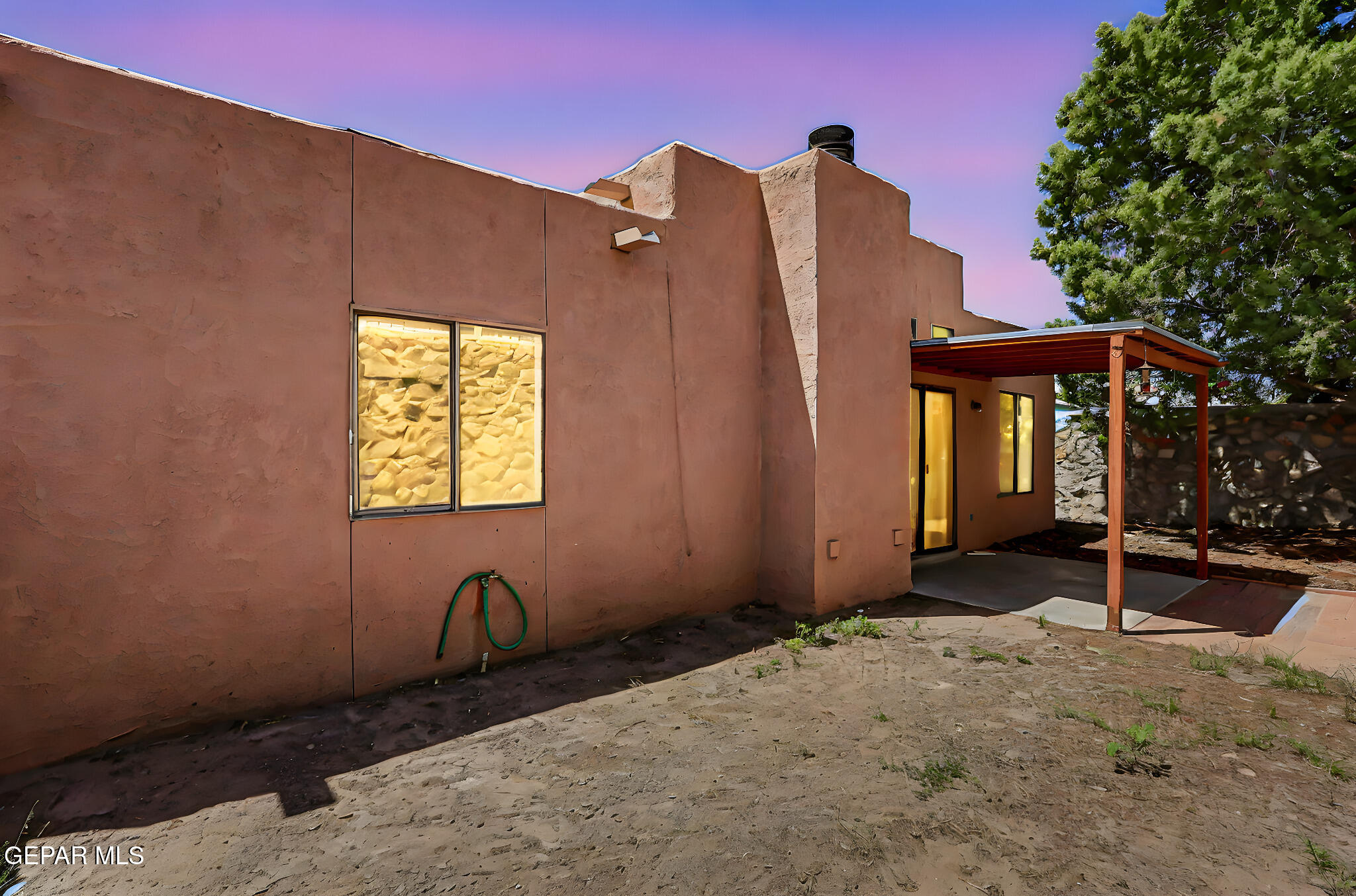 1053 Hillrise Court Las Cruces, NM 88011 - Photo 25 of 53 a view of a house with a backyard