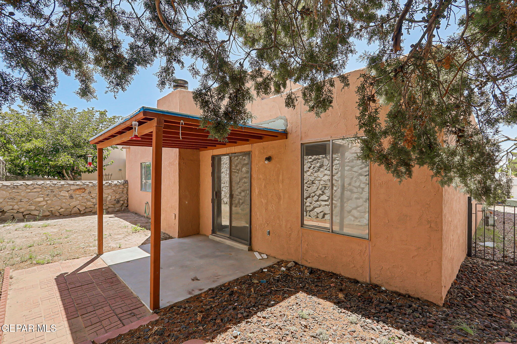 1053 Hillrise Court Las Cruces, NM 88011 - Photo 26 of 53 a front view of a house with garden