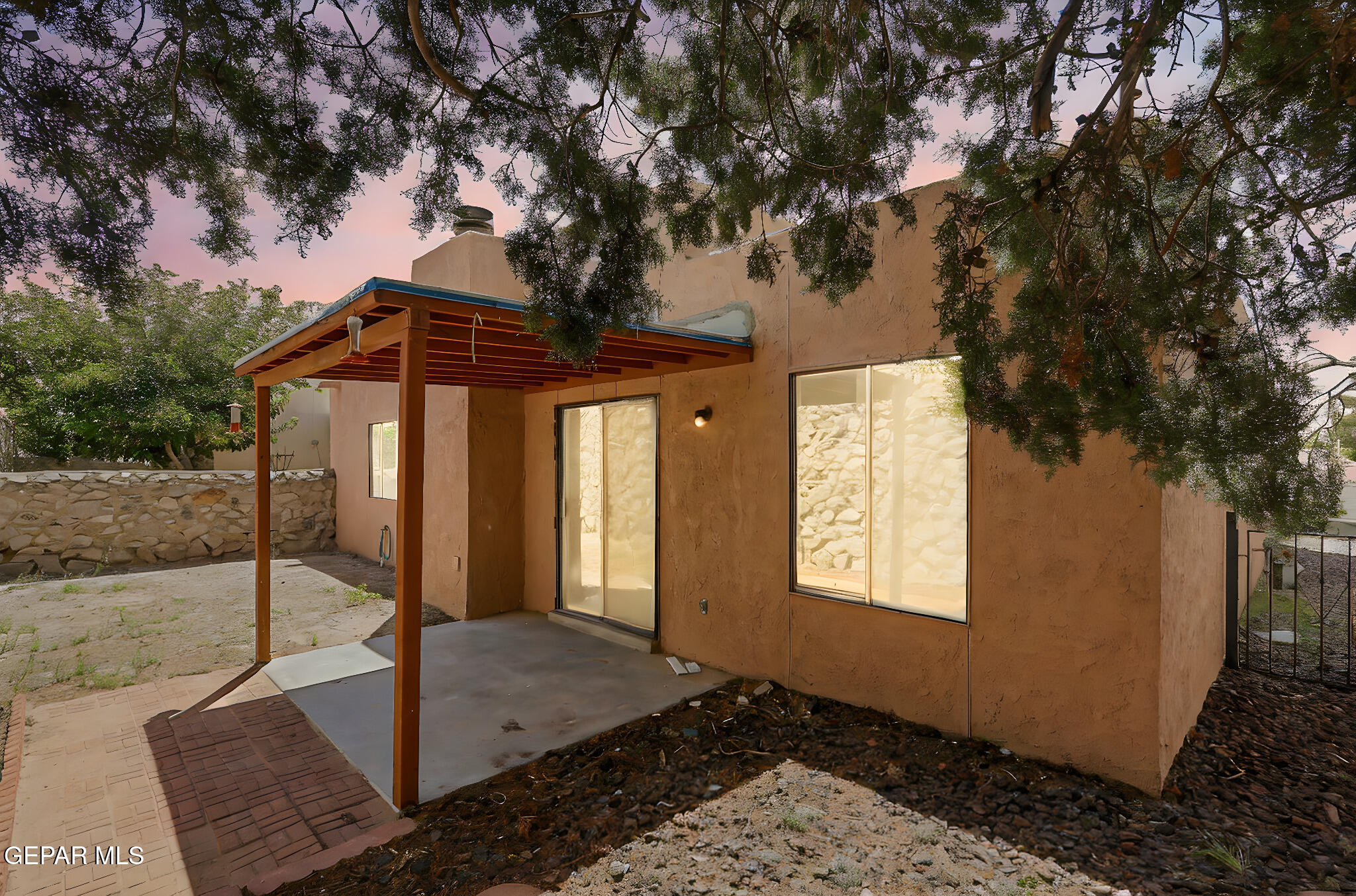 1053 Hillrise Court Las Cruces, NM 88011 - Photo 27 of 53 a front view of a house with garden