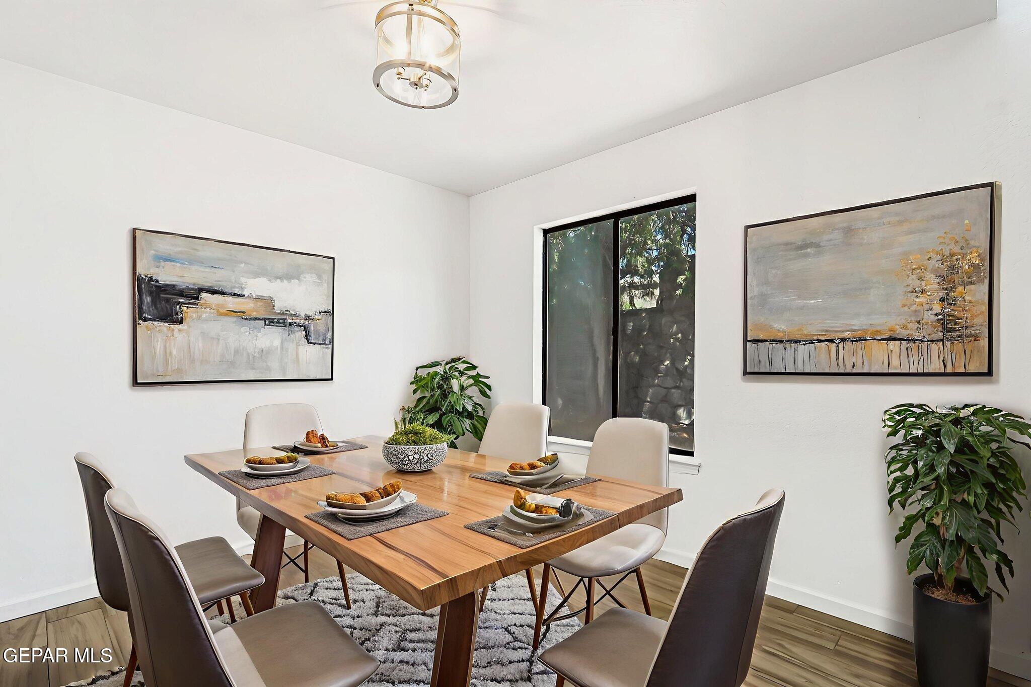 1053 Hillrise Court Las Cruces, NM 88011 - Photo 32 of 53 a view of a dining room with furniture window and wooden floor