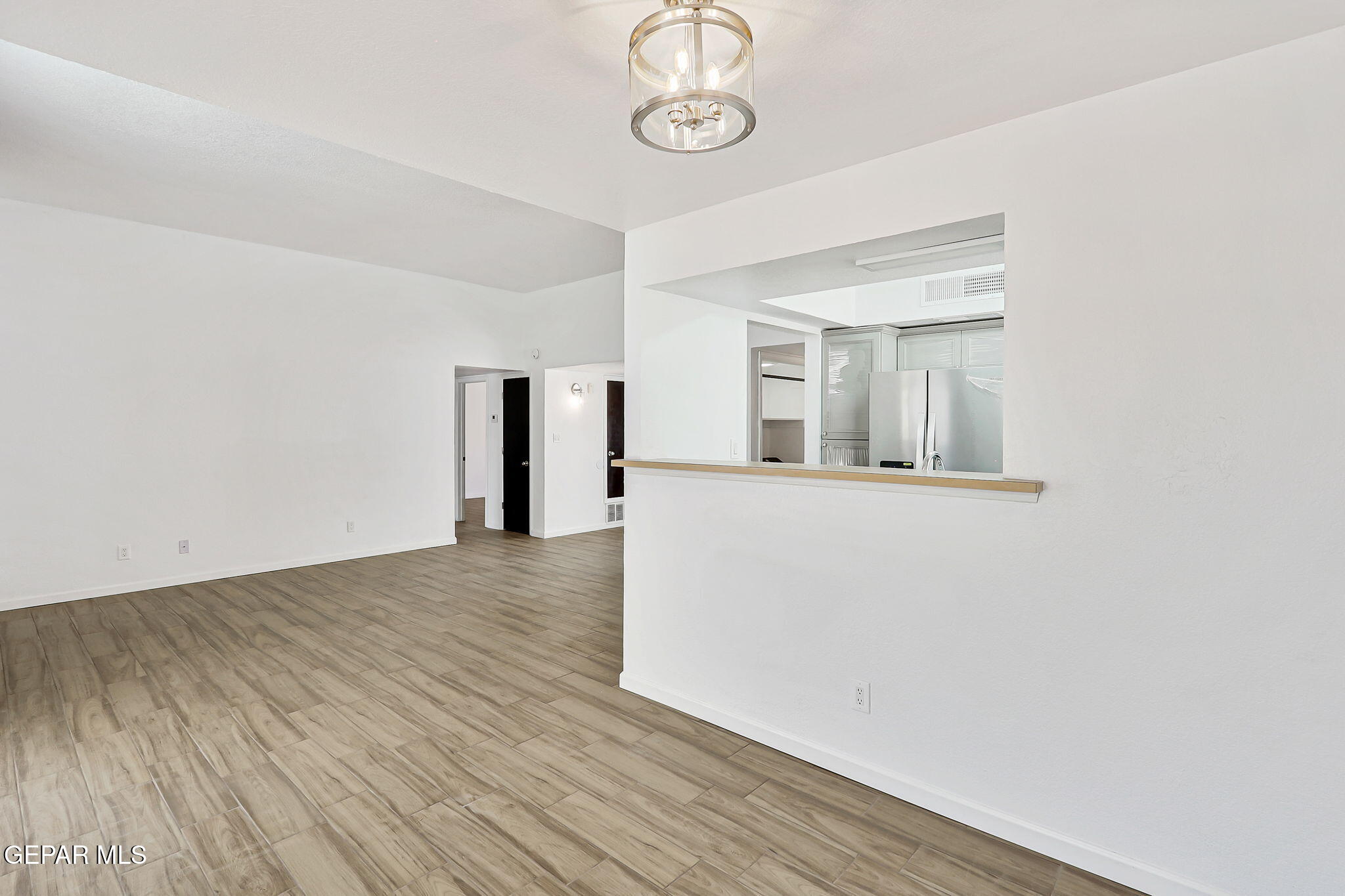 1053 Hillrise Court Las Cruces, NM 88011 - Photo 34 of 53 a view of empty room with wooden floor