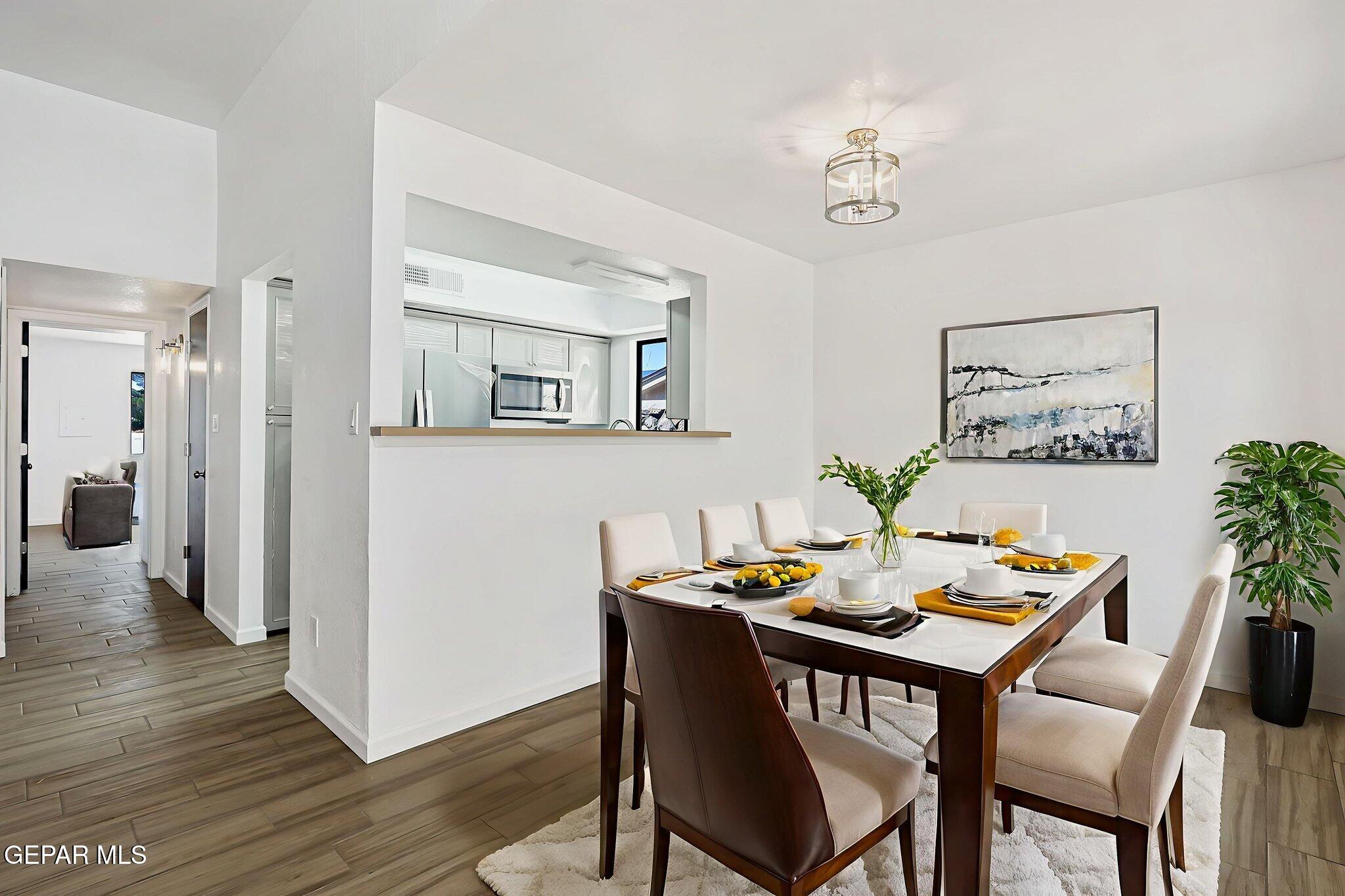 1053 Hillrise Court Las Cruces, NM 88011 - Photo 37 of 53 a view of a dining room with furniture and wooden floor