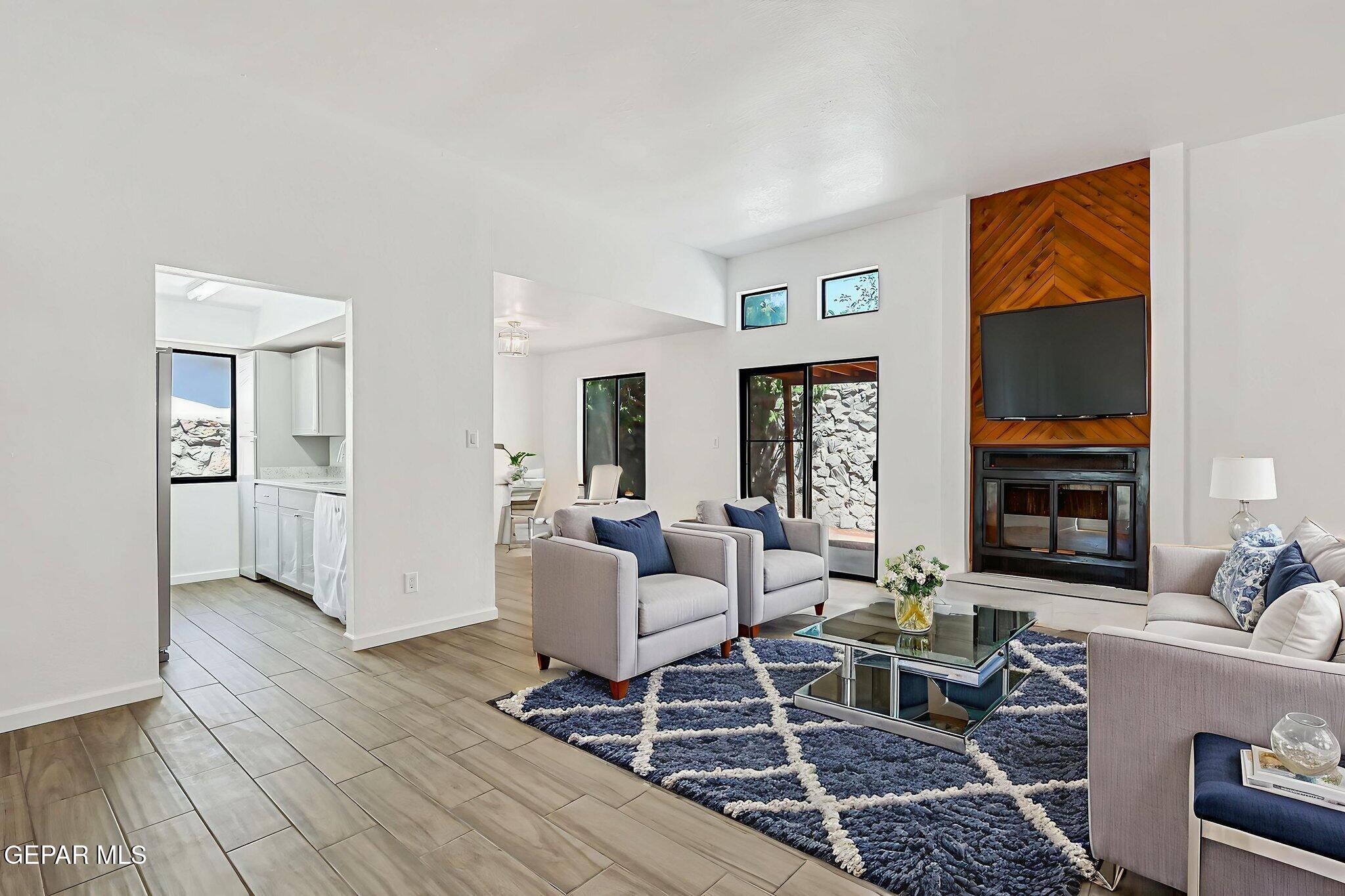 1053 Hillrise Court Las Cruces, NM 88011 - Photo 39 of 53 a living room with furniture and a fireplace