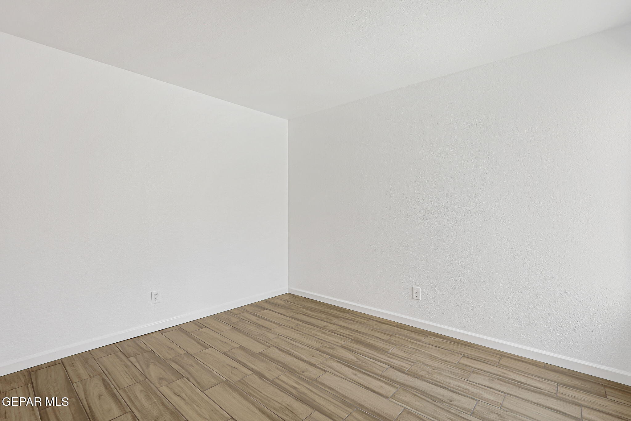 1053 Hillrise Court Las Cruces, NM 88011 - Photo 40 of 53 a view of empty room with wooden floor