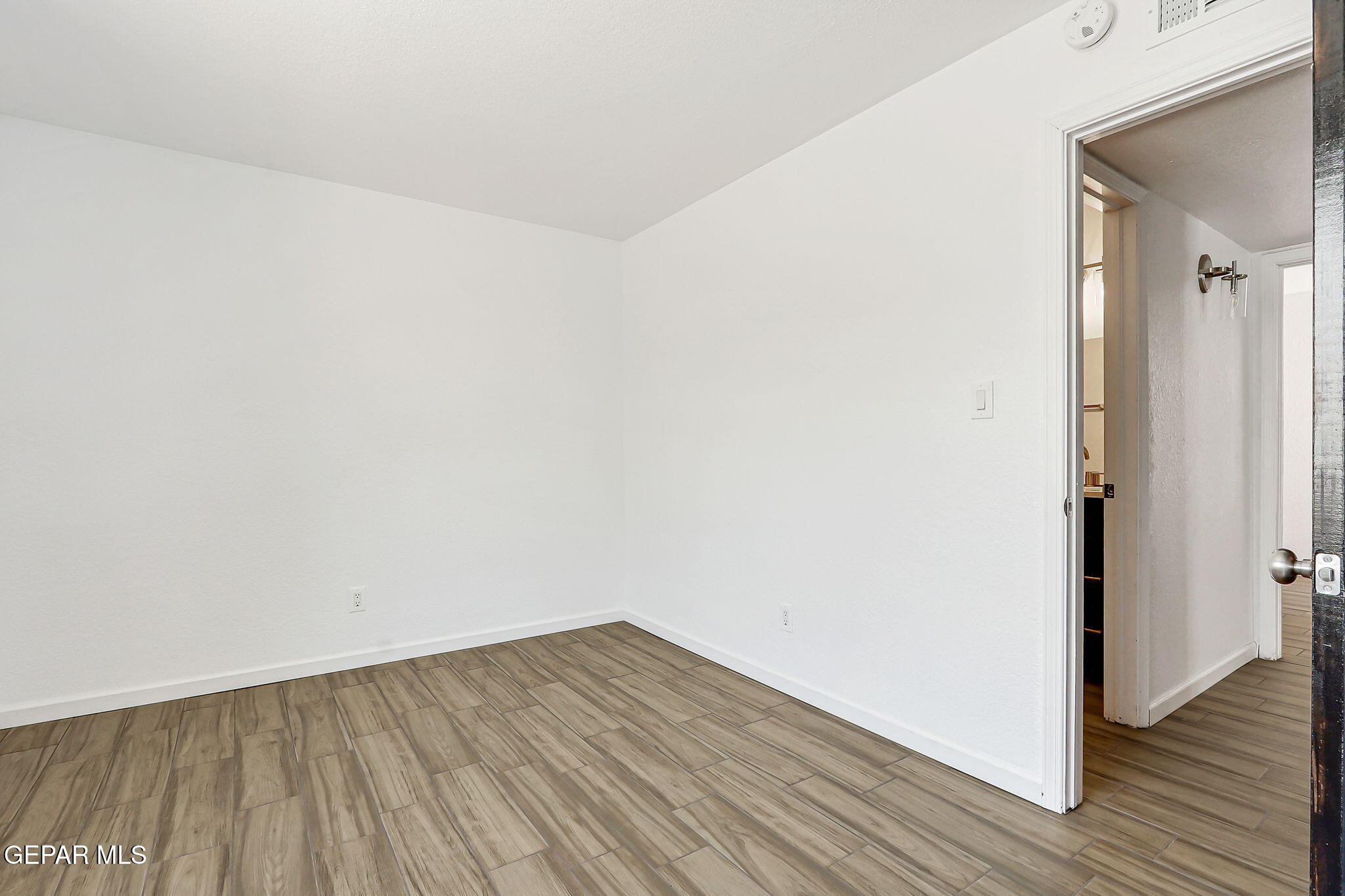 1053 Hillrise Court Las Cruces, NM 88011 - Photo 51 of 53 a view of a room with wooden floor