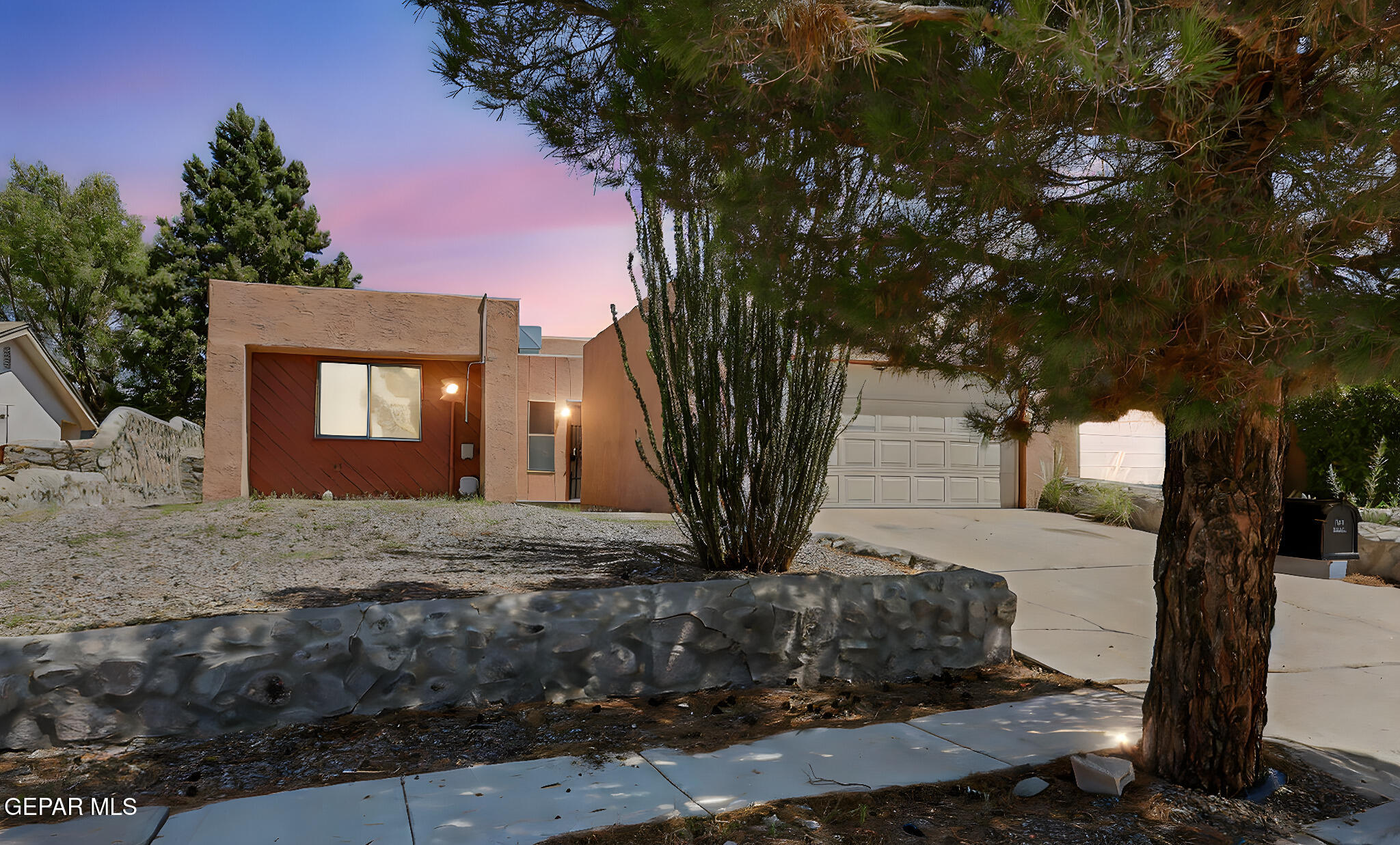 1053 Hillrise Court Las Cruces, NM 88011 - Photo 8 of 53 a front view of a house with a yard