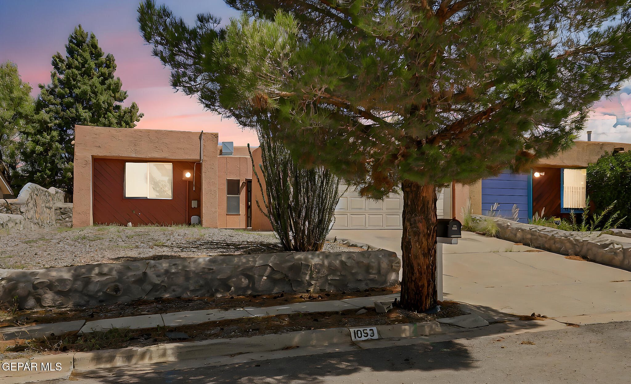 1053 Hillrise Court Las Cruces, NM 88011 - Photo 10 of 53 a front view of a house with a yard