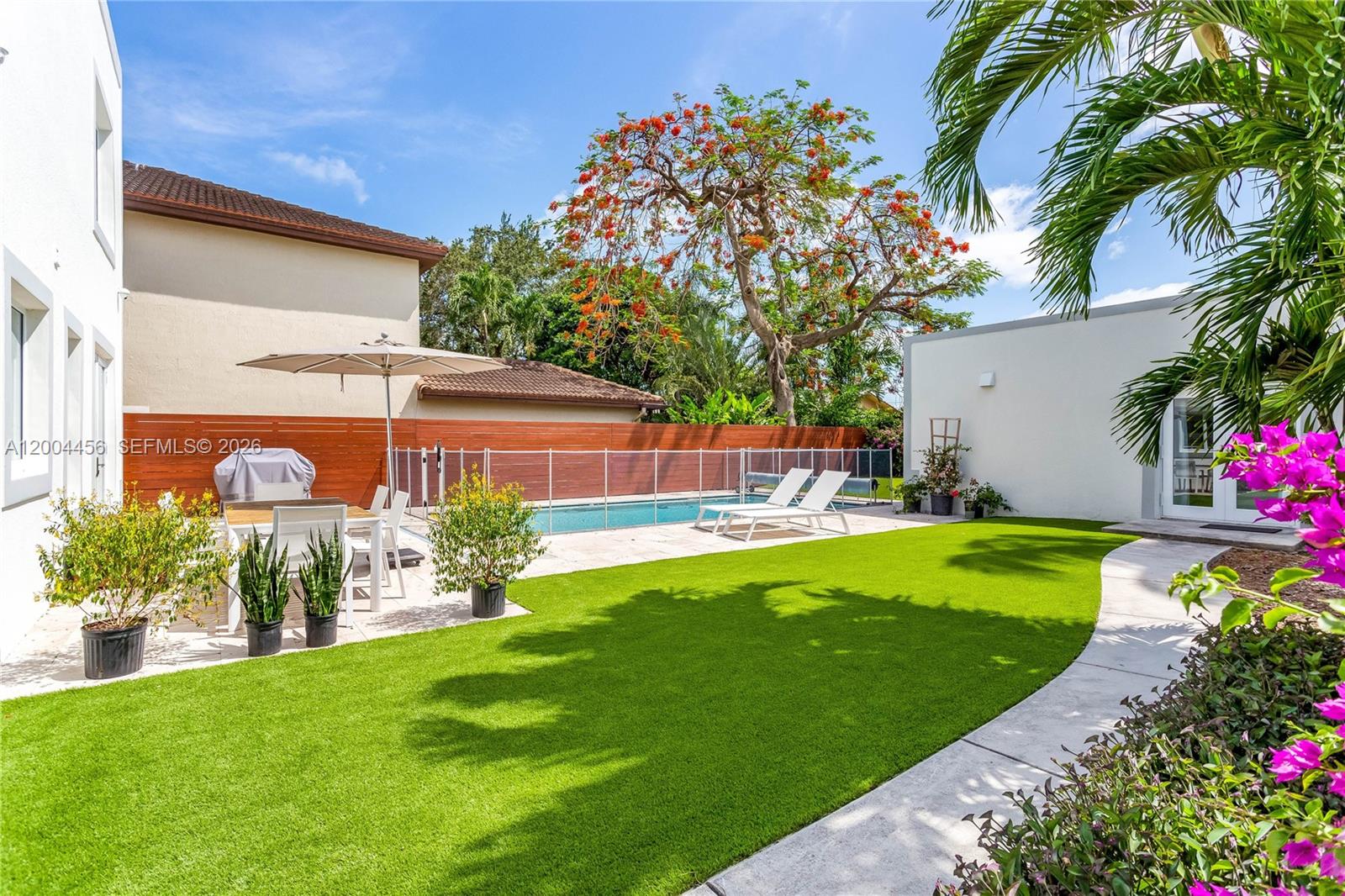 152 Southwest 20th Road Miami, FL 33129 - Photo 18 of 22 a view of a house with a yard
