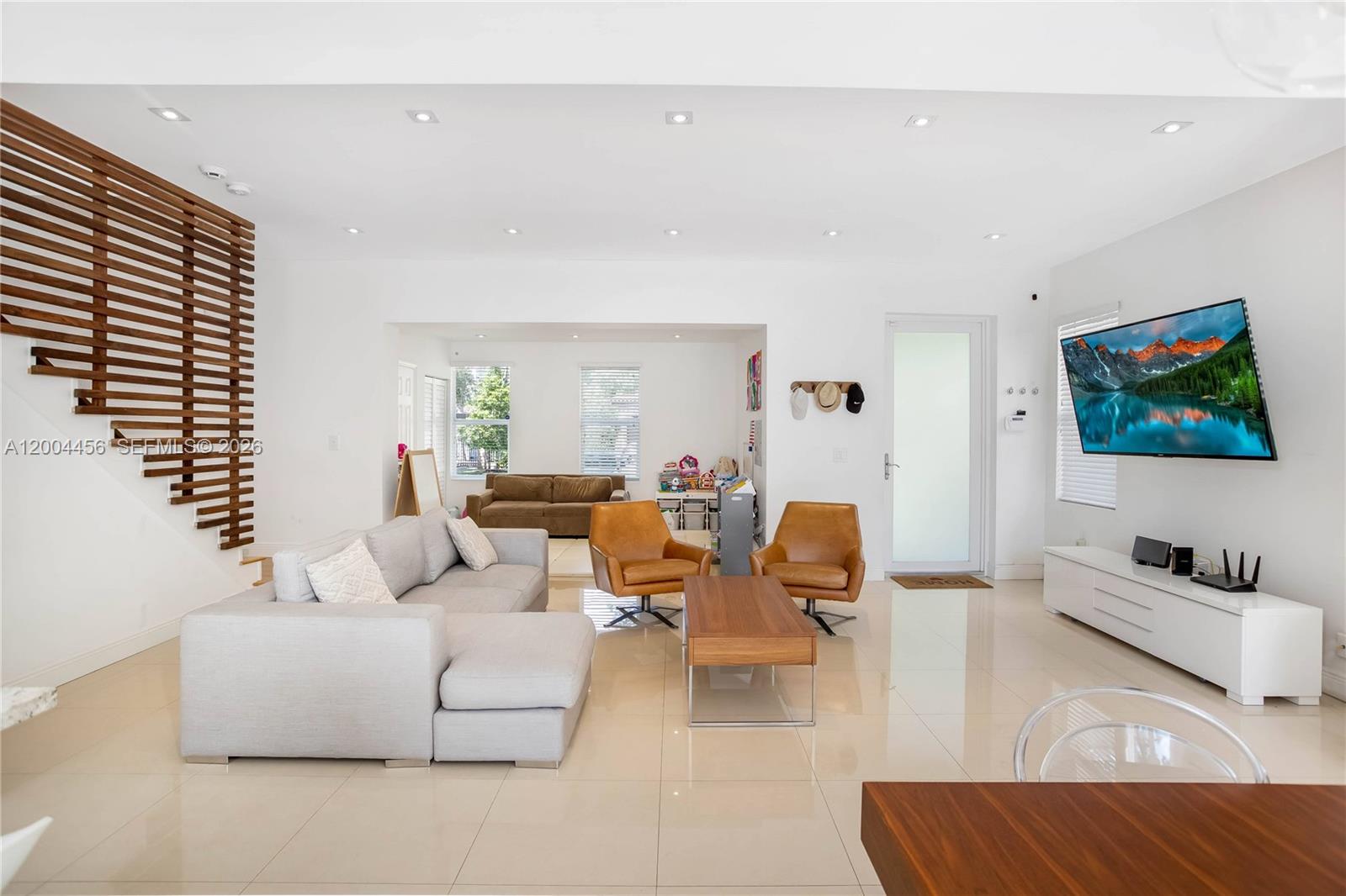152 Southwest 20th Road Miami, FL 33129 - Photo 6 of 22 a living room with furniture and a flat screen tv