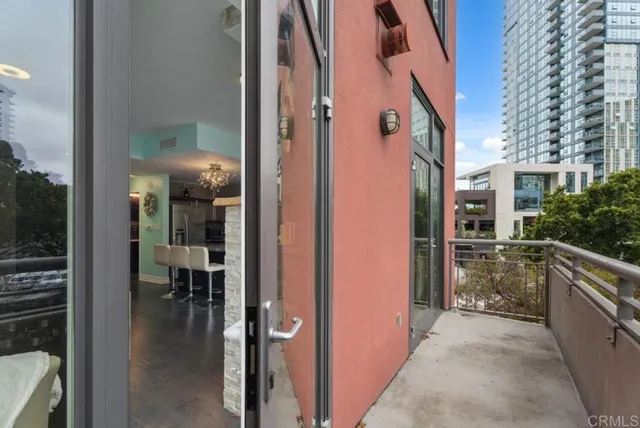 a couple of cars parked in front of a building