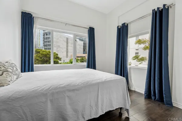 a bedroom with a bed and cabinets
