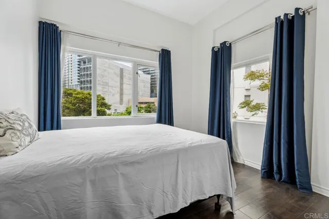 a bedroom with a bed and cabinets